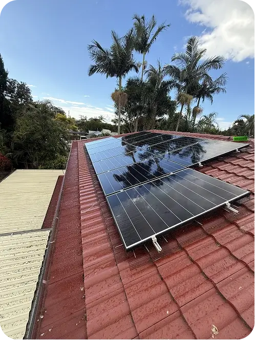 Residential solar panels with bird proofing mesh installed around the panel perimeter on a tiled roof