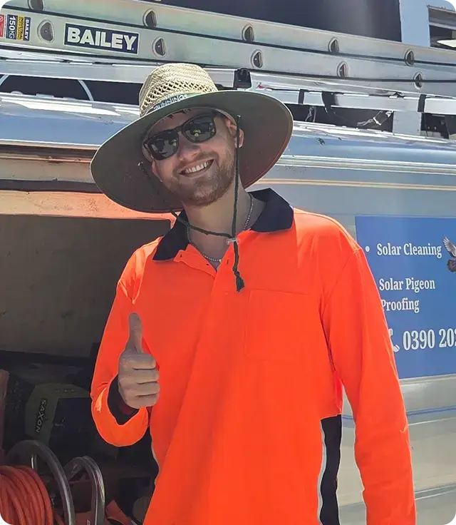EZY Solar Cleaning team member standing beside a service vehicle and equipment